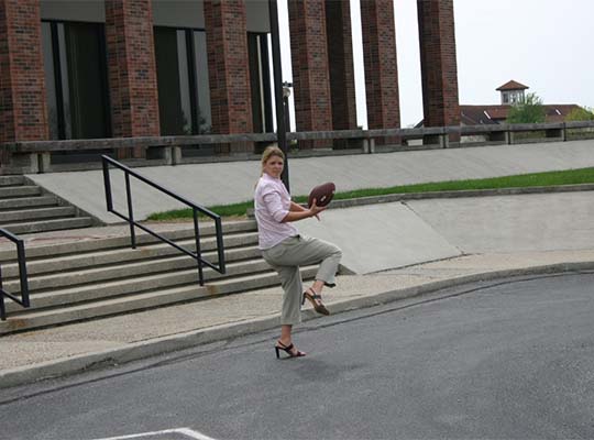 That’s Mindy Spring playing football during the 2007 face-to-face Executive Committee Meeting.