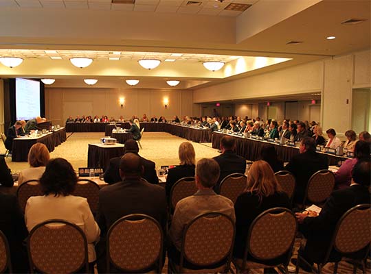 Commission members gather for the Commission’s 2012 Annual Business Meeting and 10th anniversary celebration in Madison, WI.