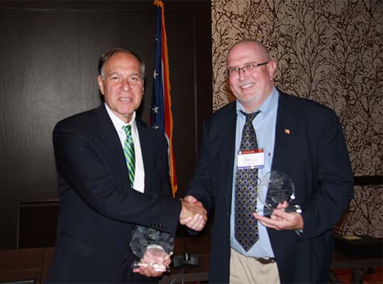 Robert Maccarone (NY) and Jim Ingle (UT) congratulate each other on receiving the Executive Chair and Executive Director awards at the 2016 Annual Business Meeting in Cleveland, OH.