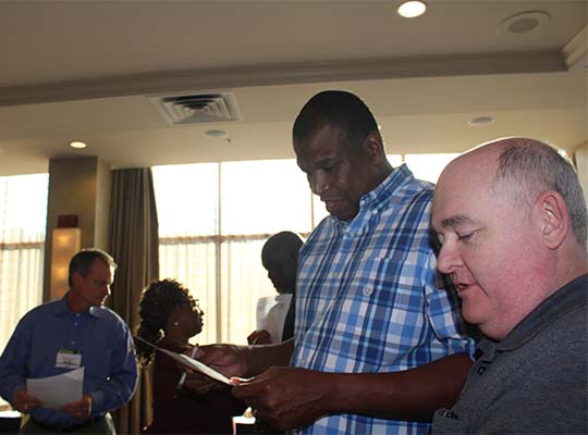 Chris Moore (GA) and Tim Strickland (FL) get to know each other better during a game of bingo at the 2017 Annual Business meeting in Pittsburgh, PA.
