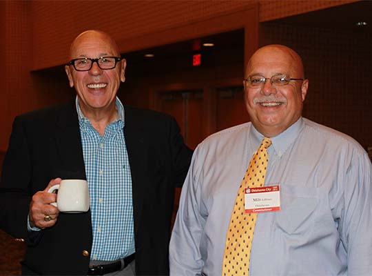 Executive Director Harry Hageman and Chair Milt Gilliam (OK) laugh during the 2014 Annual Business Meeting in Oklahoma City, OK.