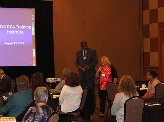 Chris Moore (GA) and Judy Mesick (ID) present at the DCA Institute during the 2014 Annual Business Meeting in Oklahoma City, OK.