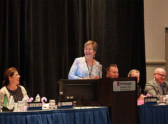 Margaret Thompson gets the crowd laughing at the 2018 Annual Business Meeting in Orlando, FL.