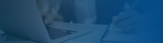 Young woman sitting at a computer taking notes under a blue gradient