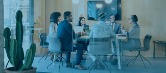 View of people sitting in a meeting around a coferecne table with a blue overlay